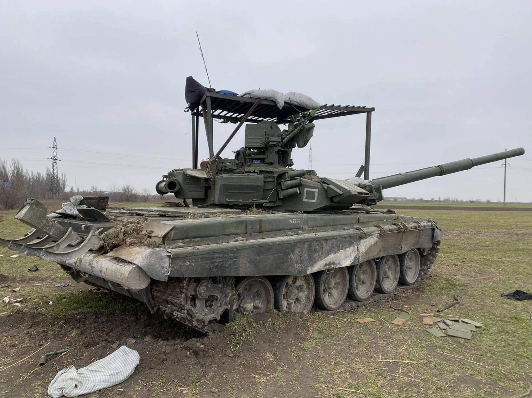 Damaged and abandoned Russian T-90A tank with a “mangal,” March 2022